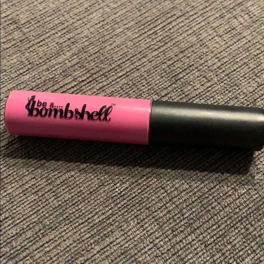 Be a Bombshell pink lip gloss. NEVER USED